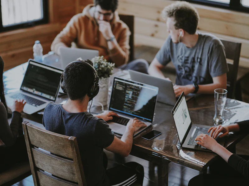 A team working together on laptops